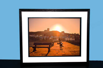 Prints for Sale of Captain Cook Sunrise in Whitby North Yorkshire.
